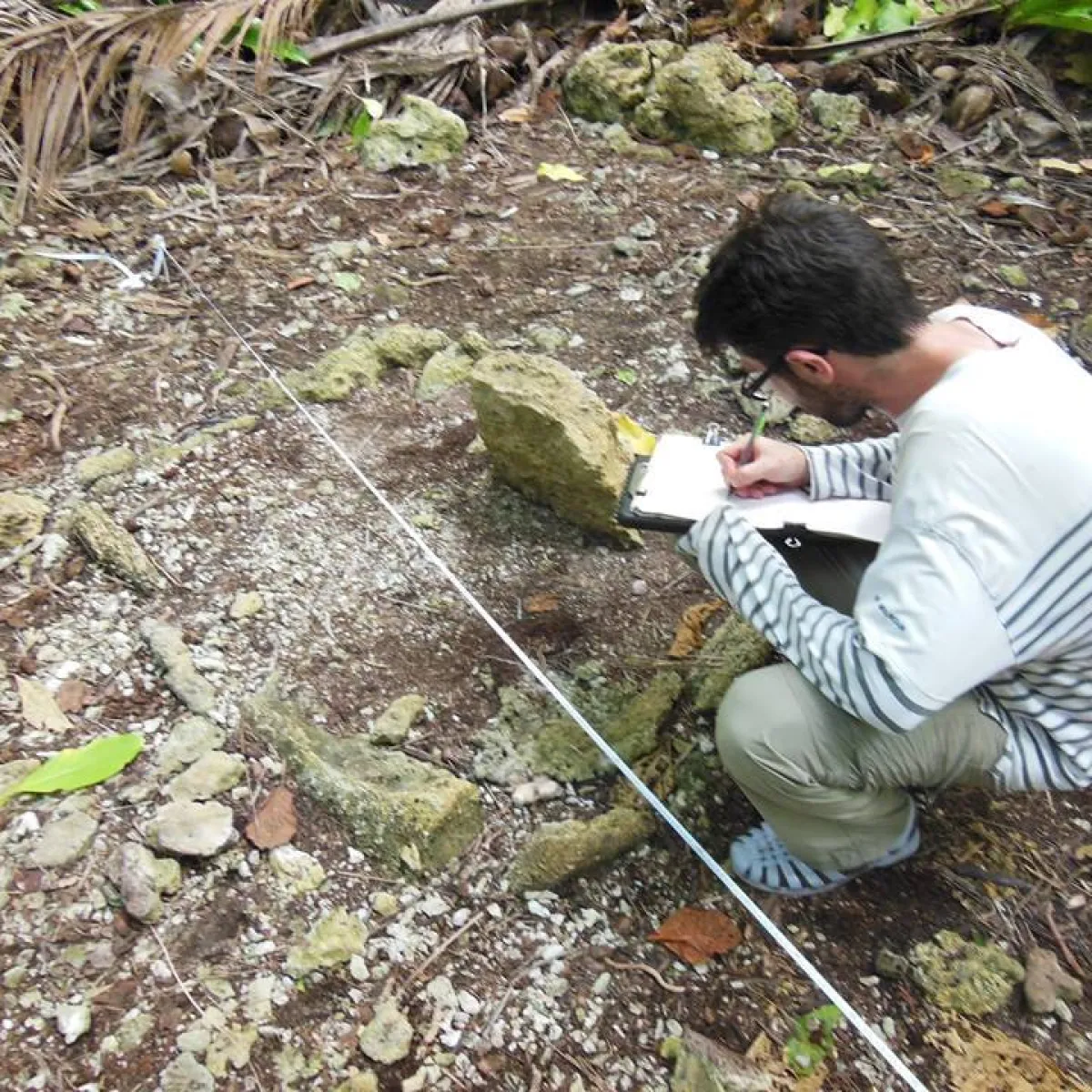 Guillaume Molle mapping a coral cist