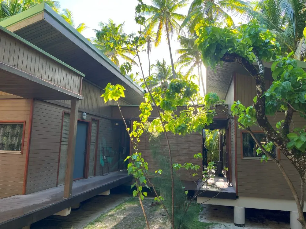 The facility is surrounded by greenery